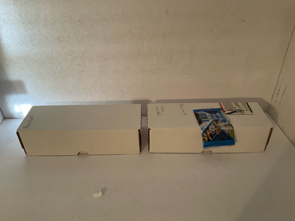 2 storage boxes of assorted sports trading cards & packs