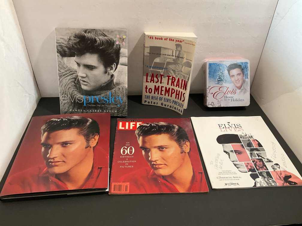 Grouping of Elvis Presley books, magazines & tin