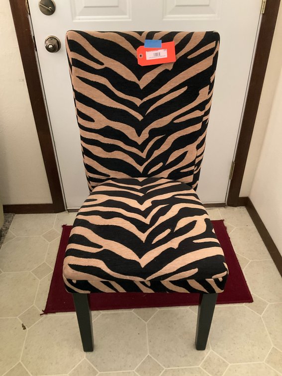 Zebra print upholstered armless accent chair