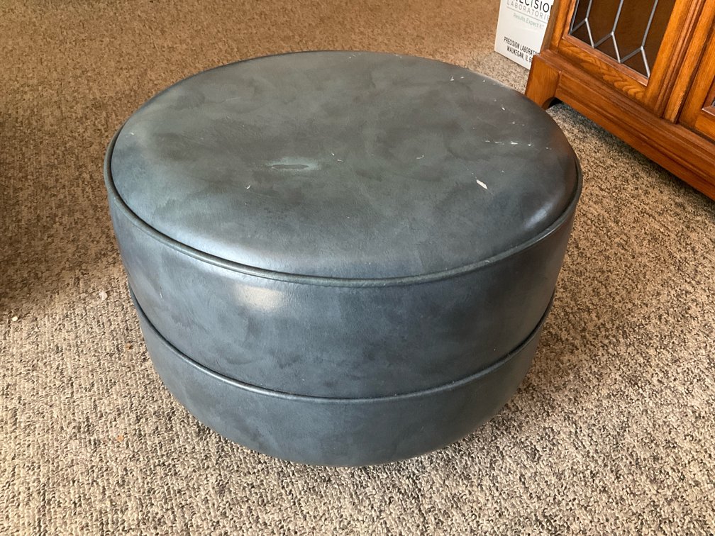 Slate blue faux leather rolling footstool