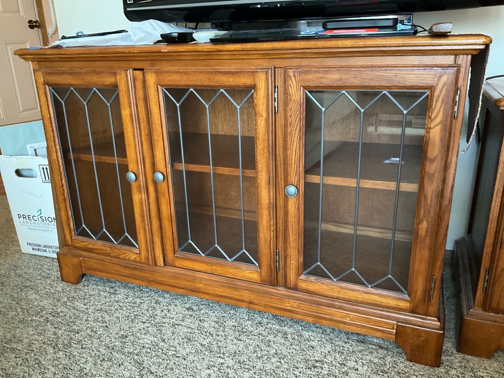 oak-finish media console with leaded glass doors