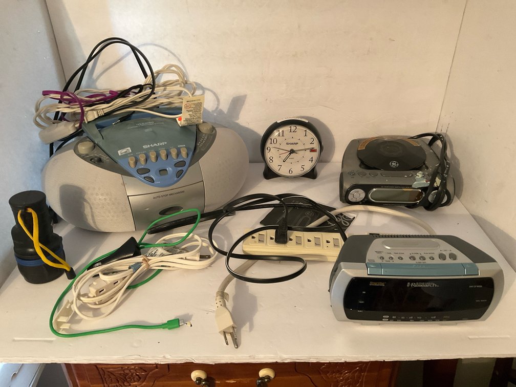Sharp boombox with assorted alarm clocks