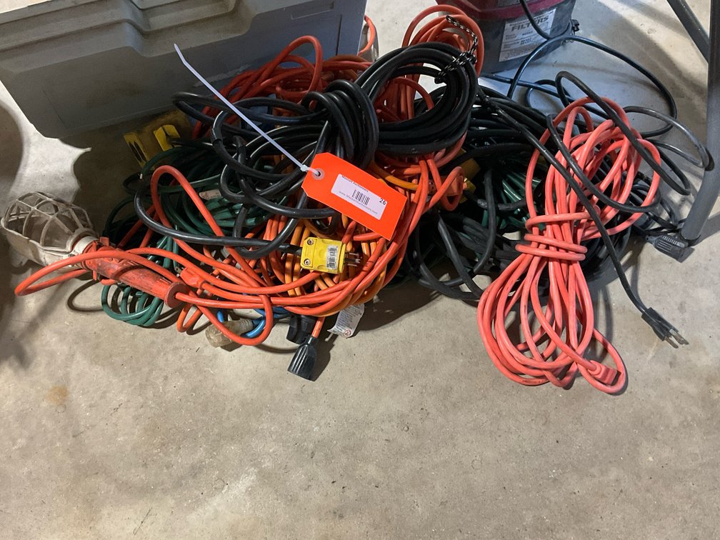 Assorted extension cords & caged trouble light
