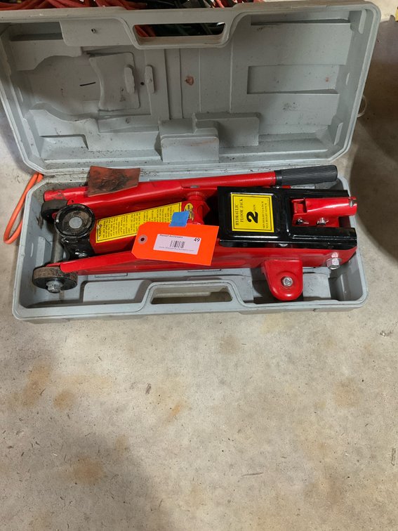 Red 2-ton hydraulic floor jack with molded case