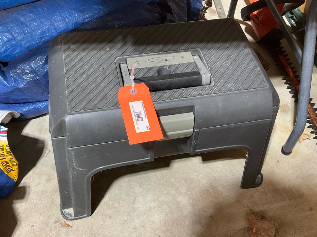 Dark gray molded plastic step stool toolbox