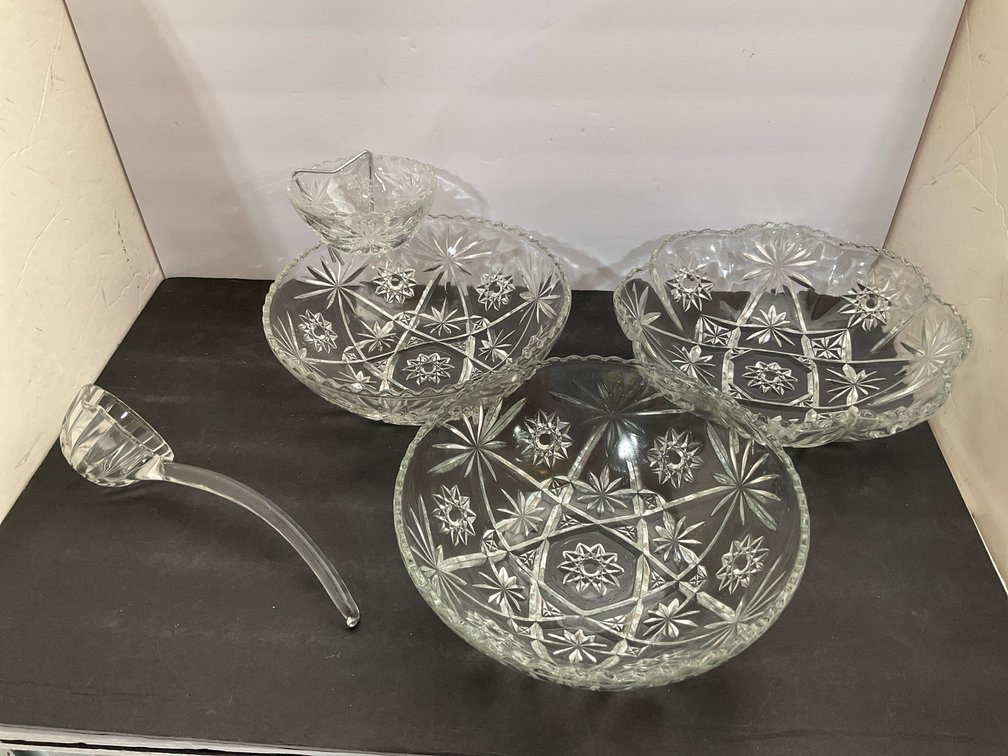 Group of clear pressed glass starburst bowl set & ladle