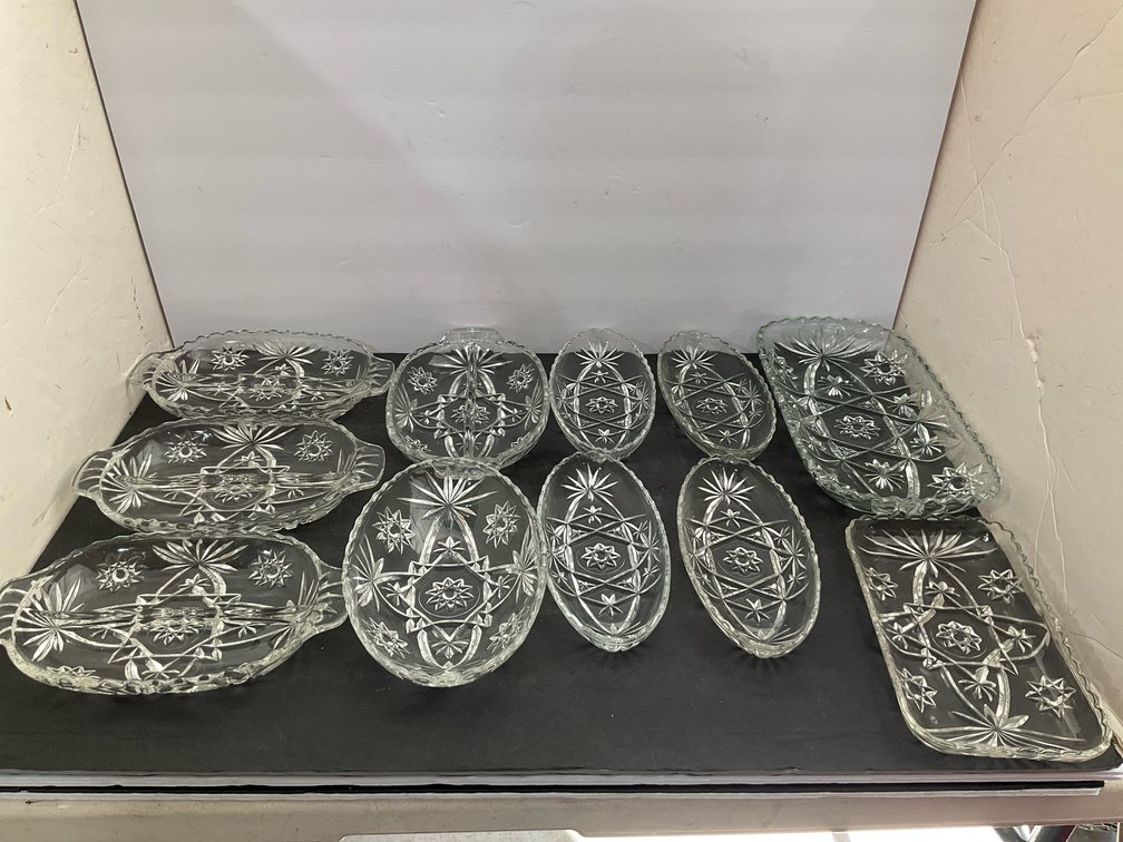 Group of clear pressed glass serving dishes & trays