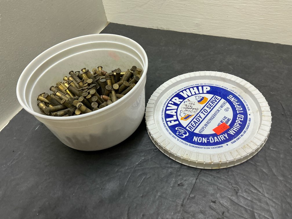 Loose rimfire ammunition cartridges with plastic tub