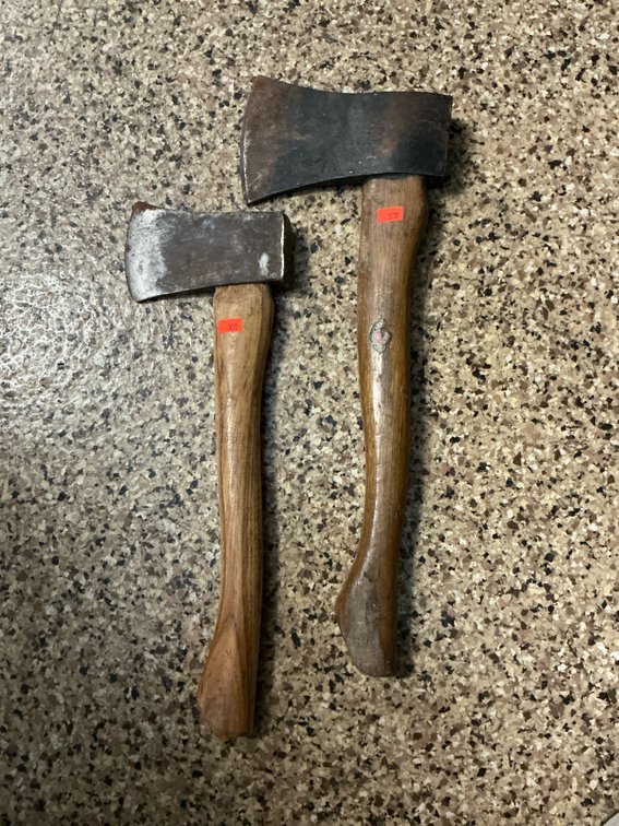 Pair of forged steel hatchets with wood handles