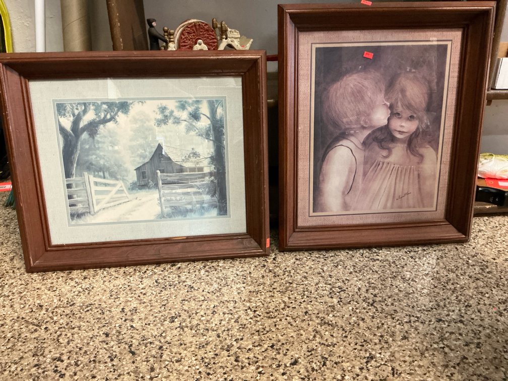 Pair of framed landscape & portrait prints in wood frames