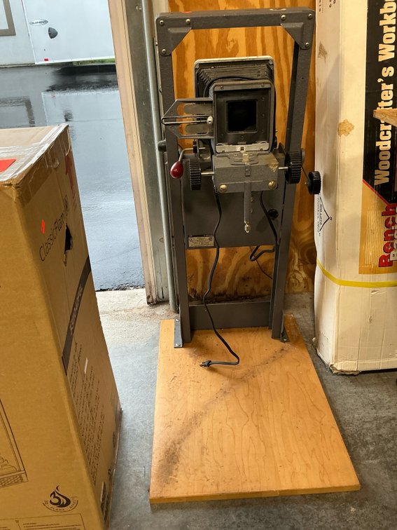 Beseler photographic enlarger on wood baseboard
