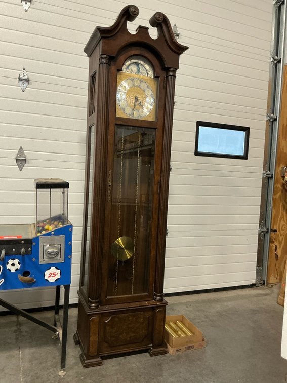 Dark wood grandfather clock with moon phase dial