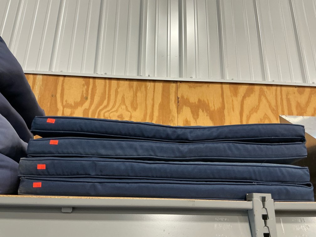 Pair of navy blue hinged outdoor chair cushions