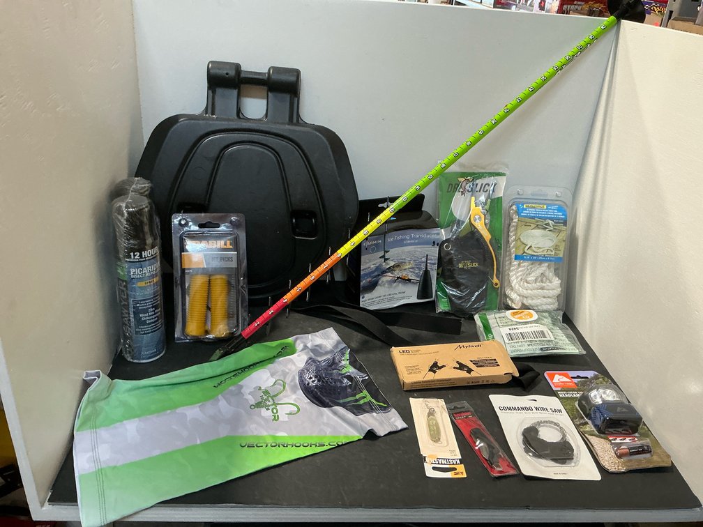 Assorted ice fishing & outdoor gear with accessories