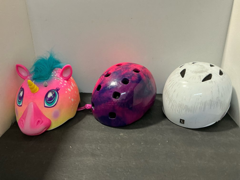 Grouping of 3 helmets including unicorn & skate styles