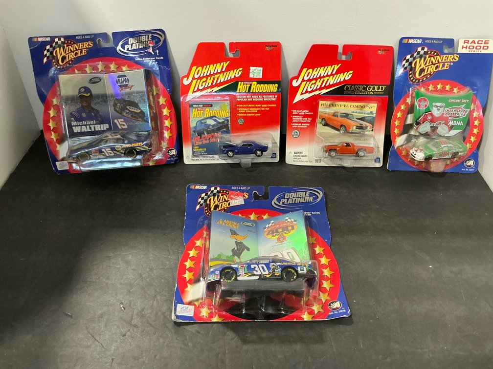 Carded die-cast cars with collector cards & race hood