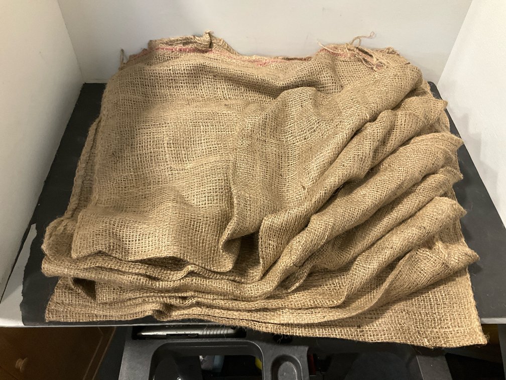 Grouping of coarse woven jute burlap sacks