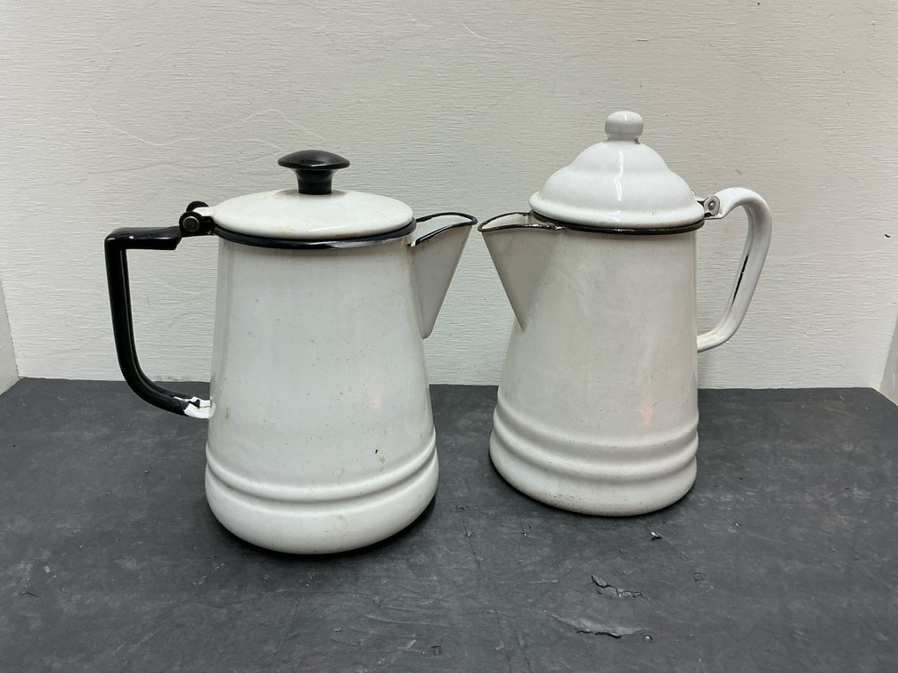 Pair of white enamelware coffee pots with black trim