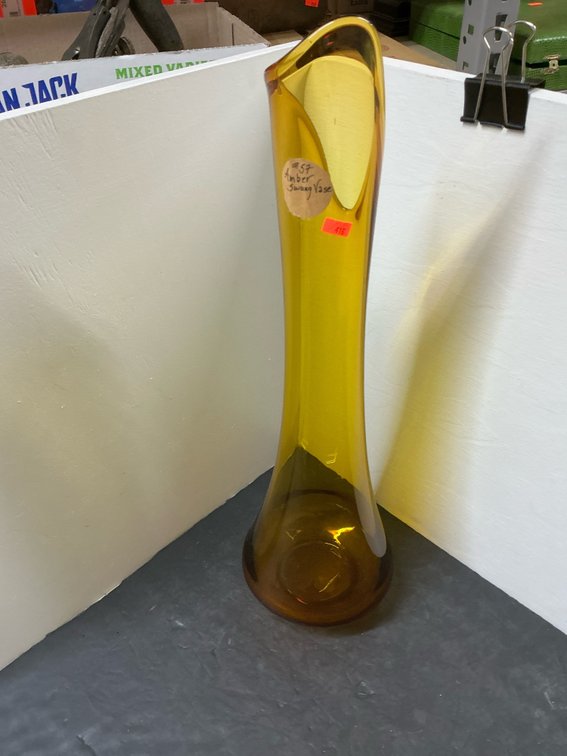Amber glass swung vase with asymmetrical pulled rim