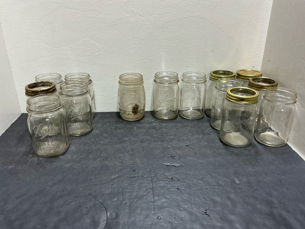 Assorted clear glass canning jars