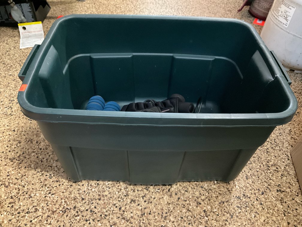 Assorted exercise equipment with plastic storage tote