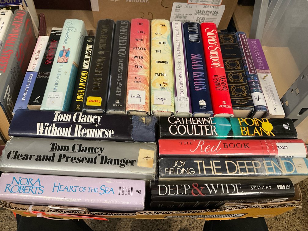 Grouping of hardcover fiction & non-fiction books