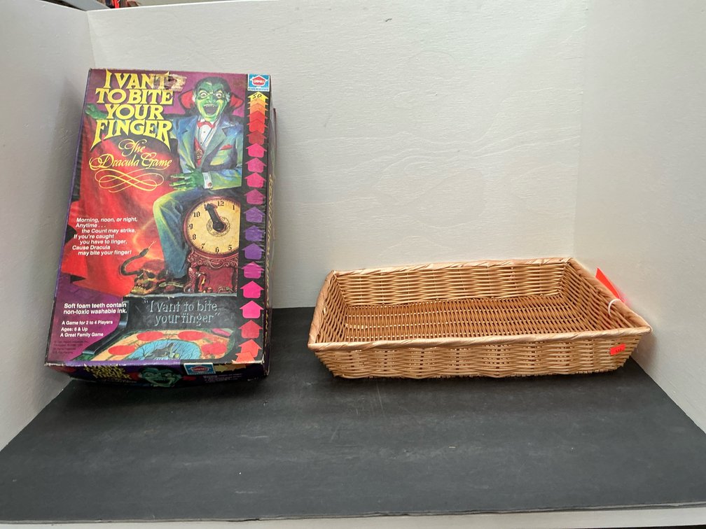 Grouping of board games with woven basket tray