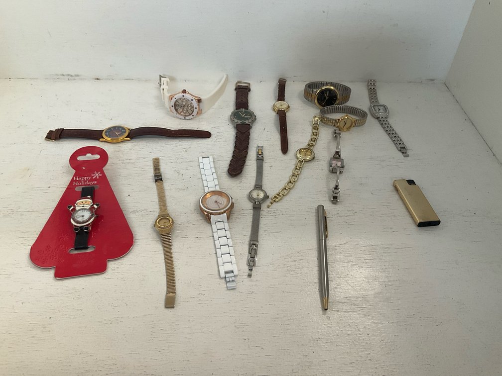 Grouping of wristwatches with pen & lighter