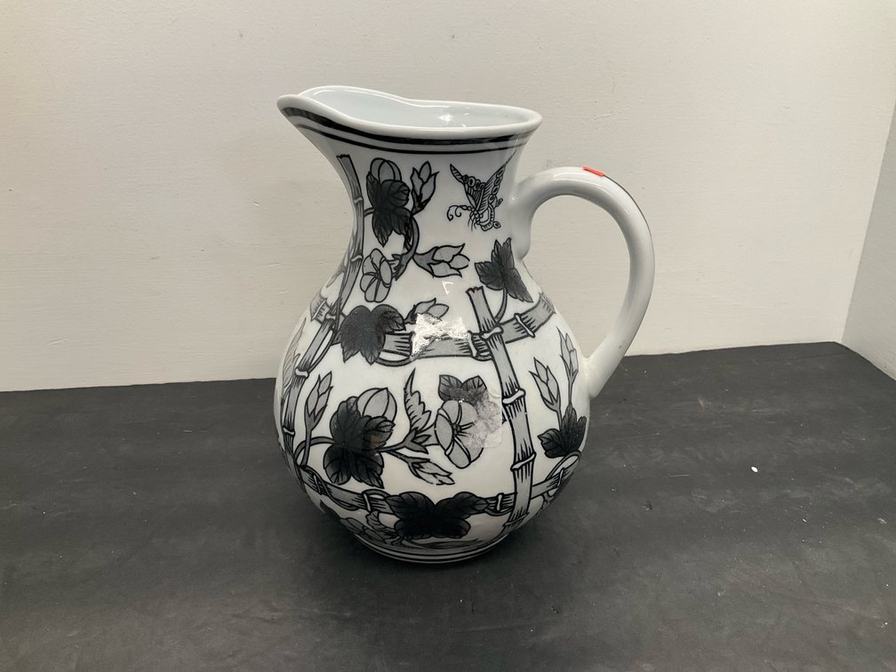 White ceramic pitcher with bamboo & floral motif