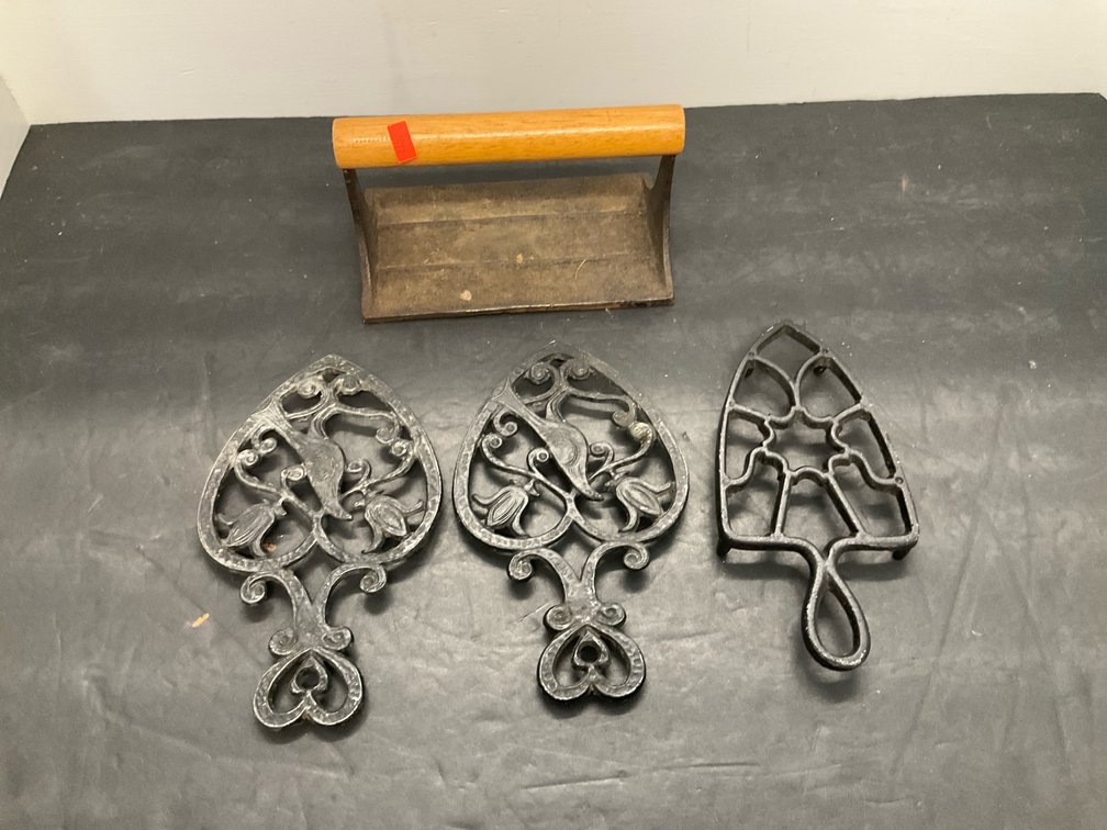 3 cast iron trivets & wood-handled bacon press