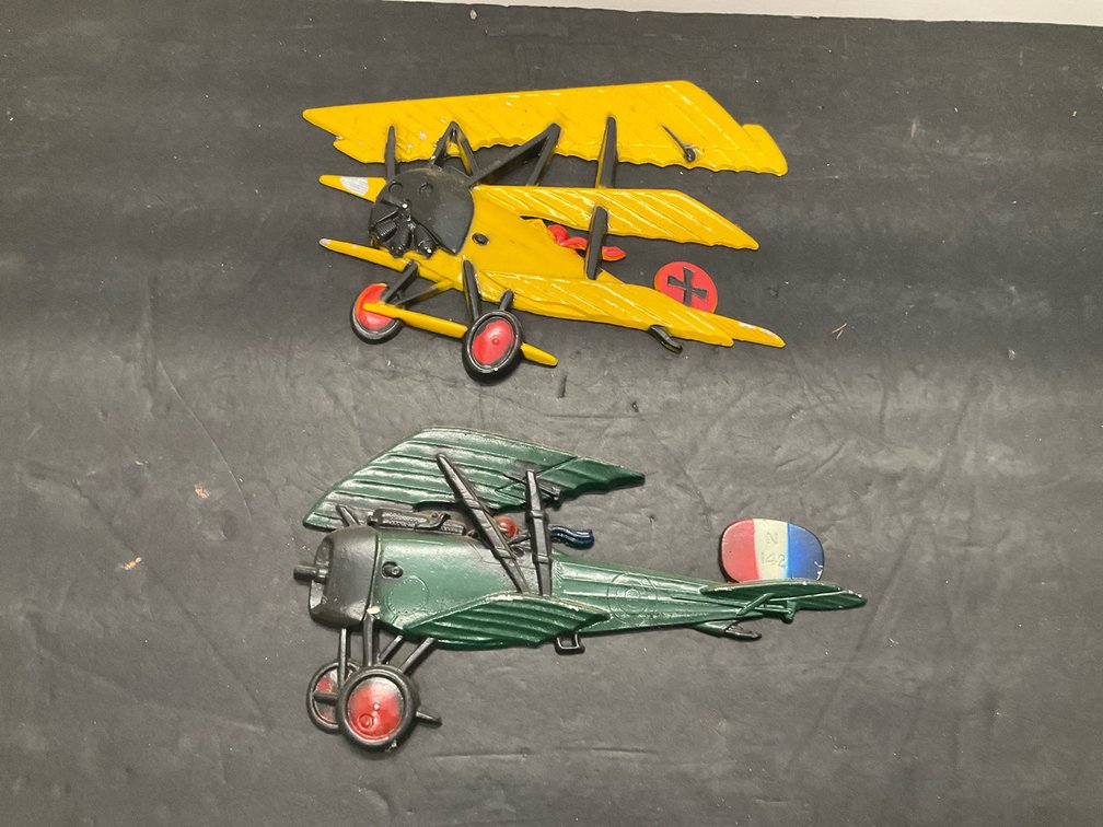 Pair of cast metal WWI airplane wall plaques