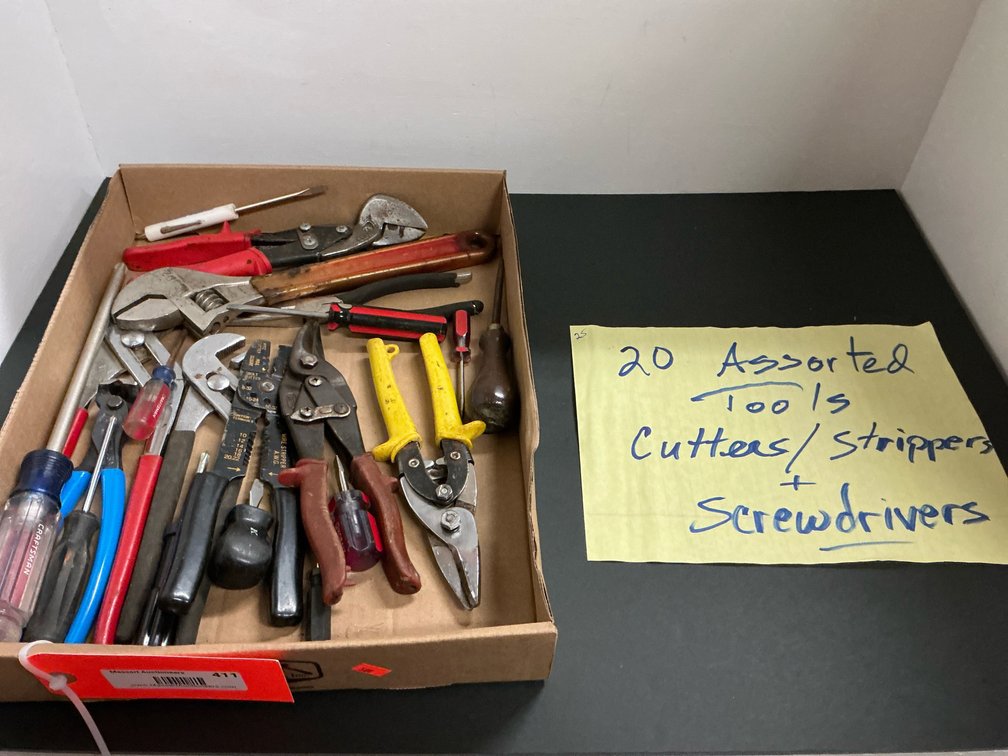 Assorted hand tools with pliers, snips & screwdrivers