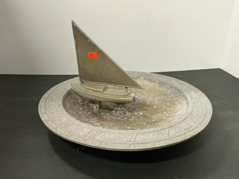 Cast metal sundial with sailboat gnomon 13” diameter