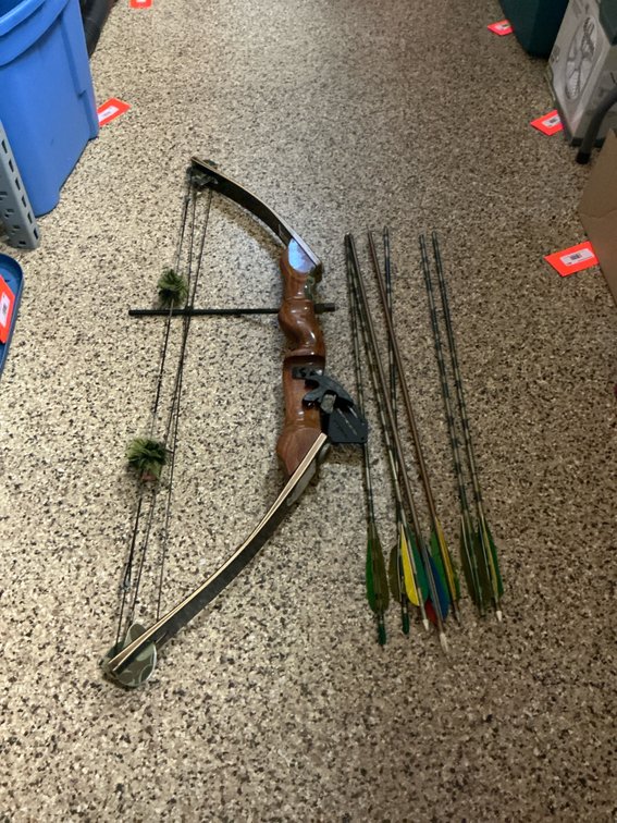 American Archery compound bow with arrows