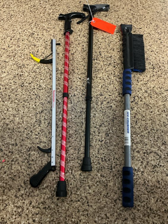 Grouping of walking canes, reacher & snowbrush