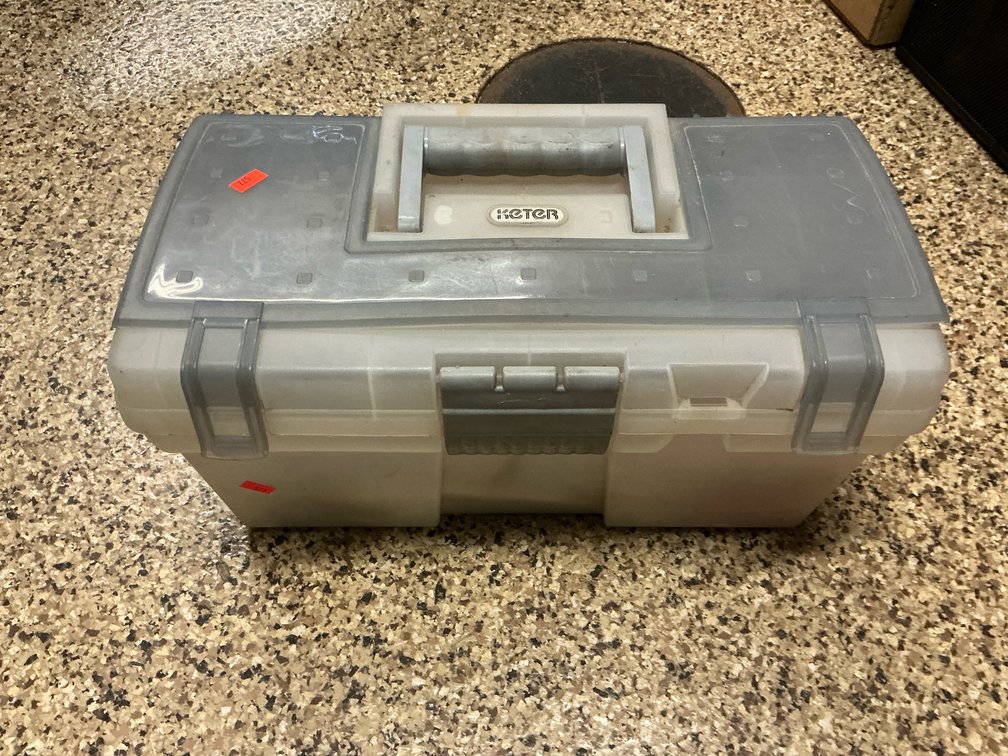 Translucent plastic toolbox with assorted hand tools