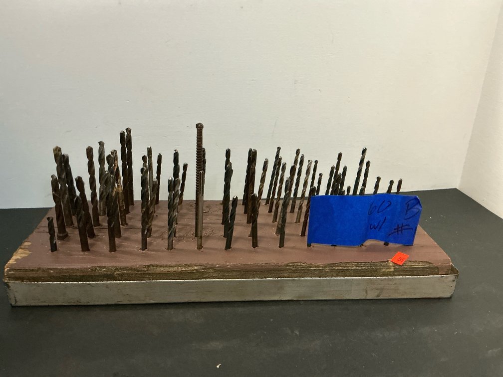 Twist drill bits in wooden block with metal tray