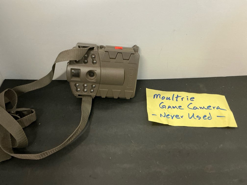 Moultrie game camera with mounting strap
