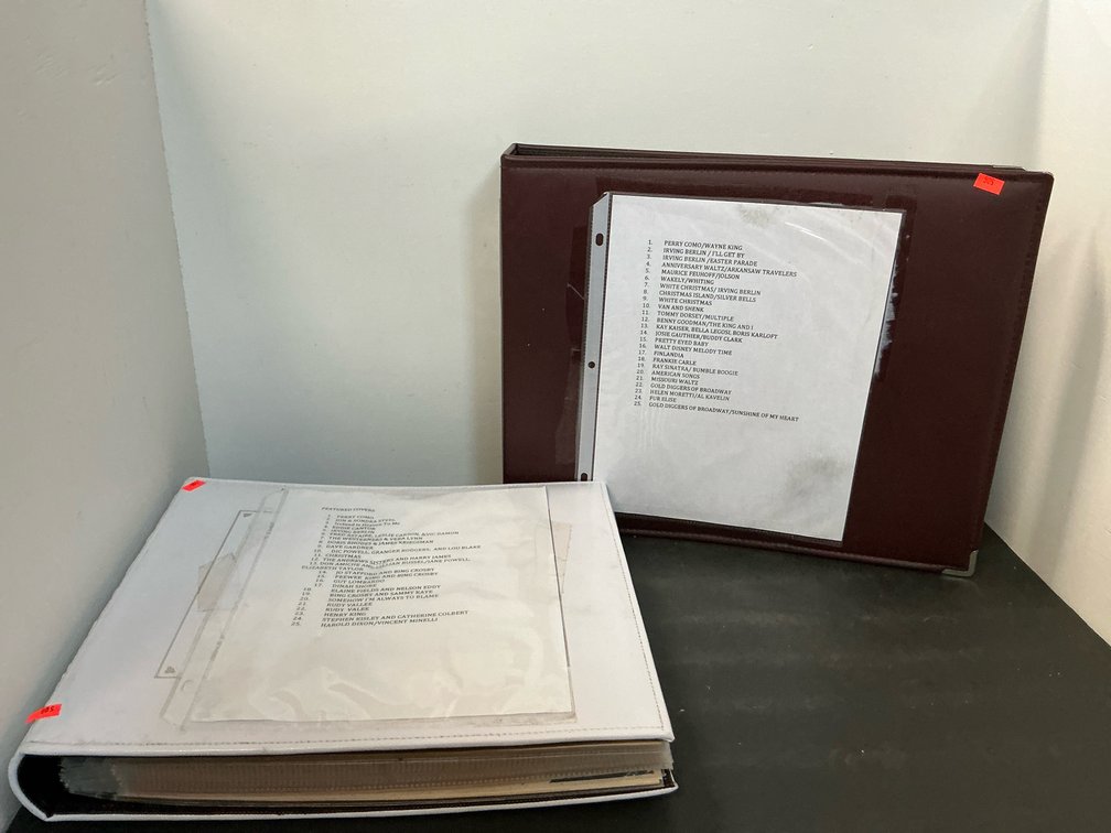 2 binders of sheet music with protective sleeves