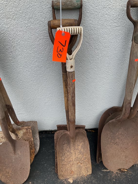 Assorted D-handle shovels with wood shafts