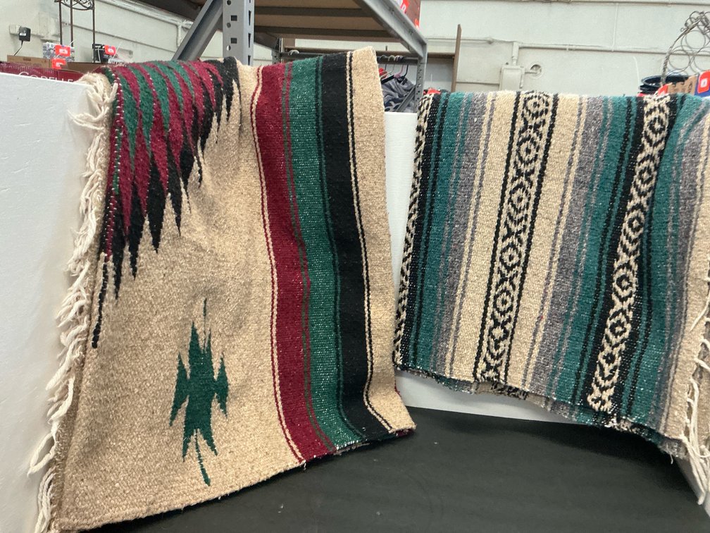 Pair of woven blankets with geometric patterns