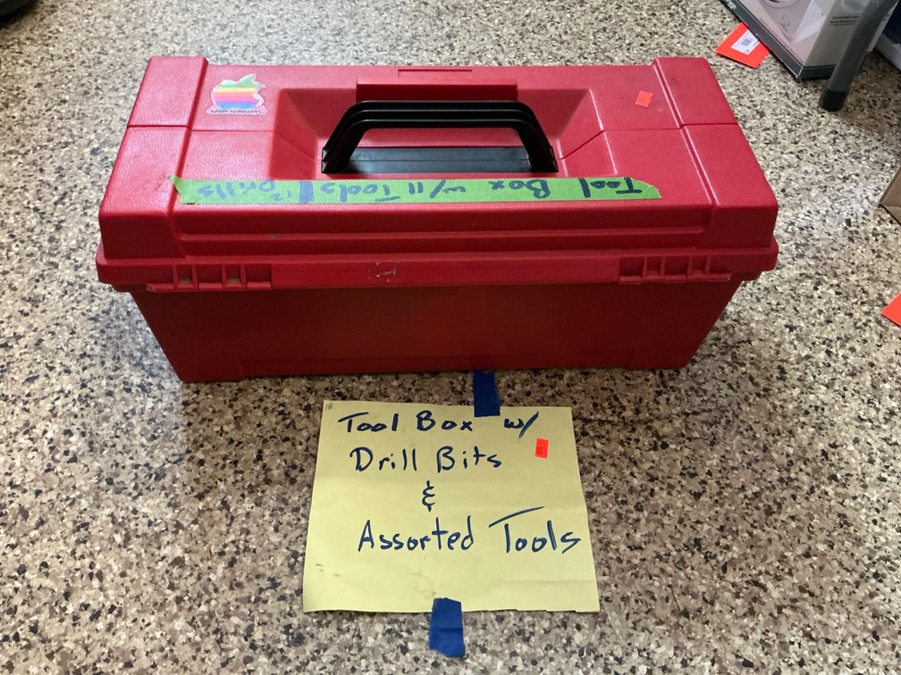 Red plastic toolbox with hand tools & drill bits
