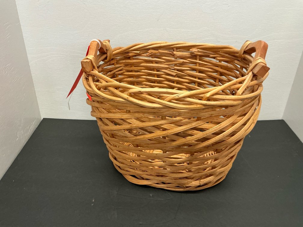 Woven wicker basket with carved wooden handles