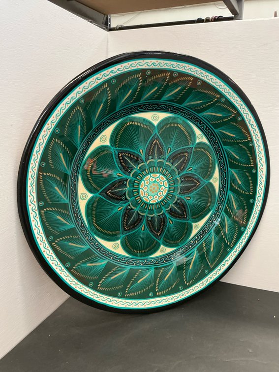 Green and teal ceramic mandala wall charger