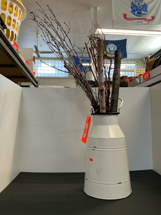 White metal milk can vase with decorative branches