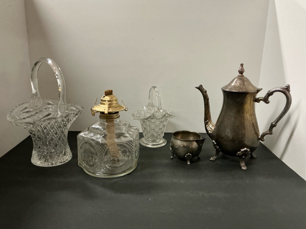 Coffee pot, creamer, two baskets, and oil lamp base.