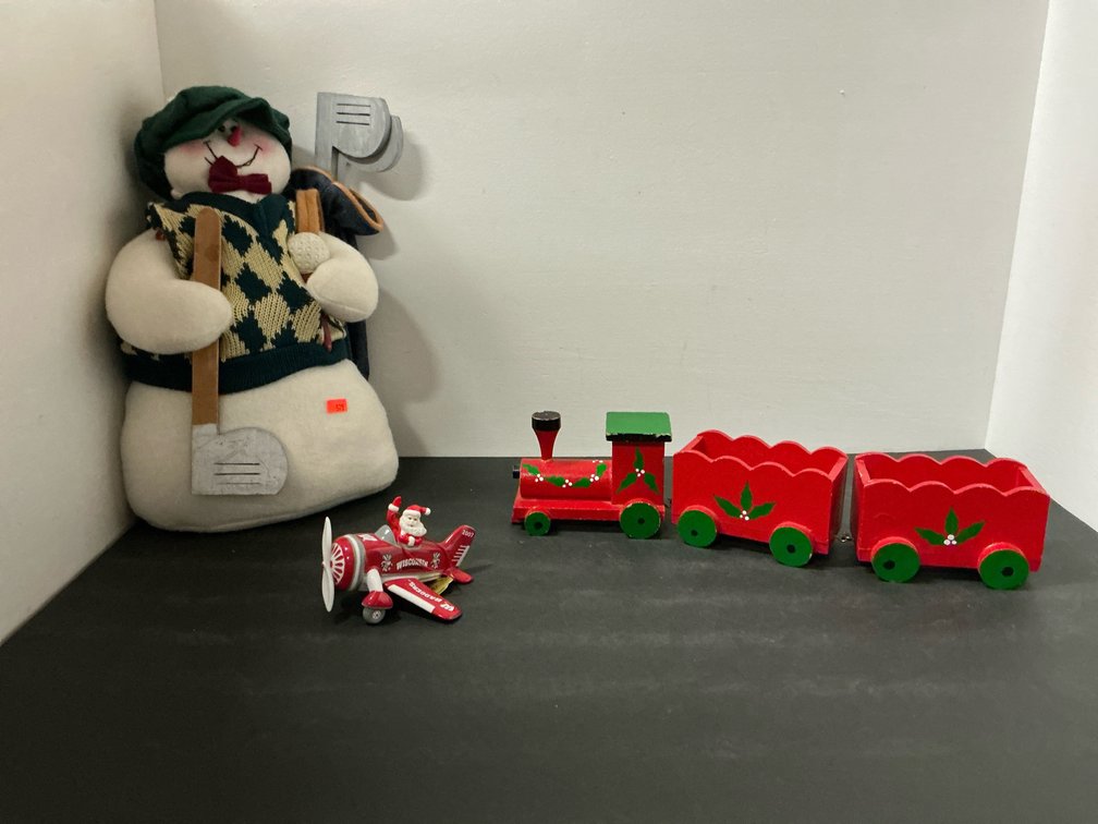 Holiday decor with snowman plush, ornament & wooden train