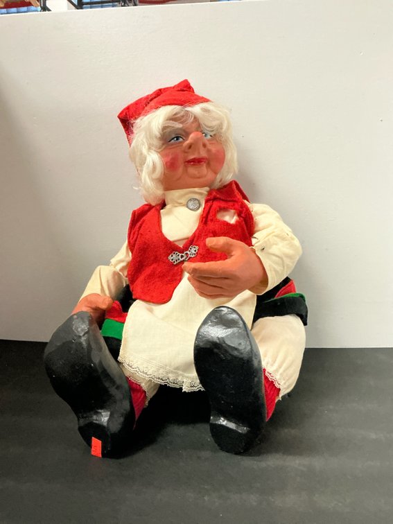 Seated Scandinavian folk doll in red cap, Marked "Arne Hasle Askim Norge" on sole.