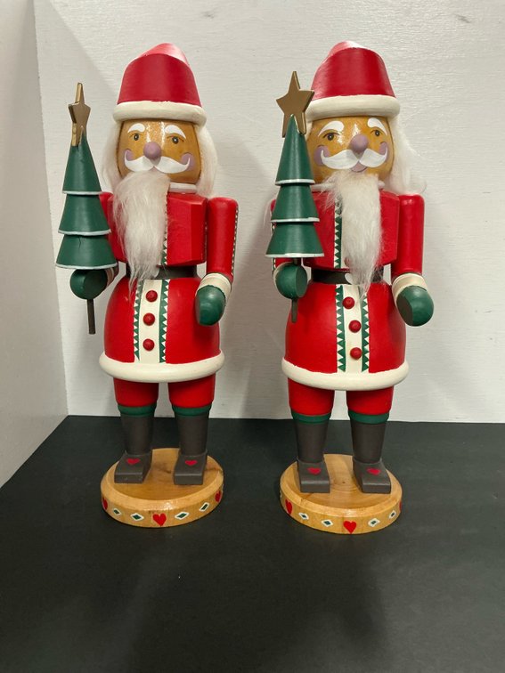Pair of wooden Santa Claus nutcrackers with trees