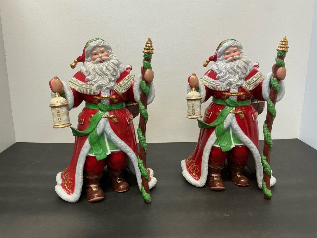 Pair of ceramic Santa Claus figurines with staffs & lanterns 10” tall